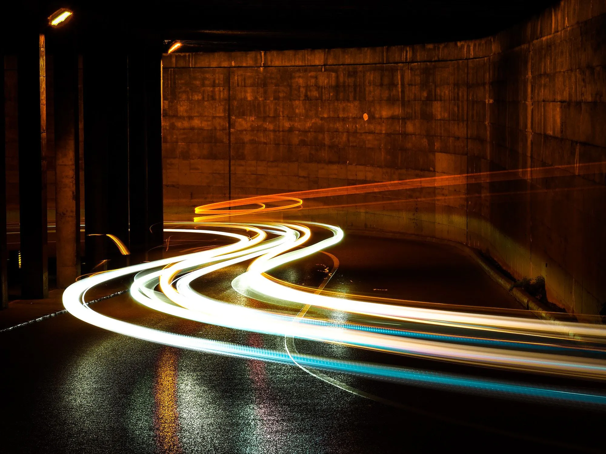 Time-delay photo of car headlights in a tunnel