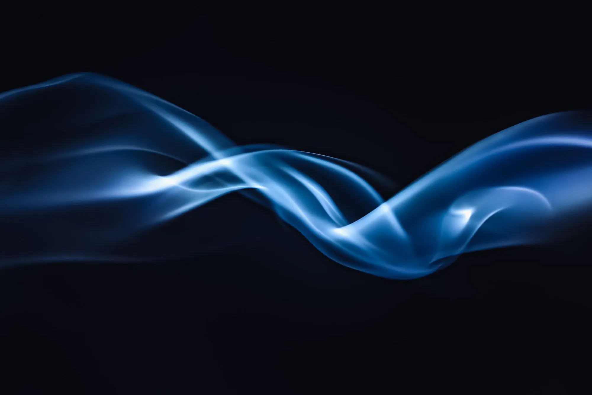 Photo of a blue ribbon of smoke